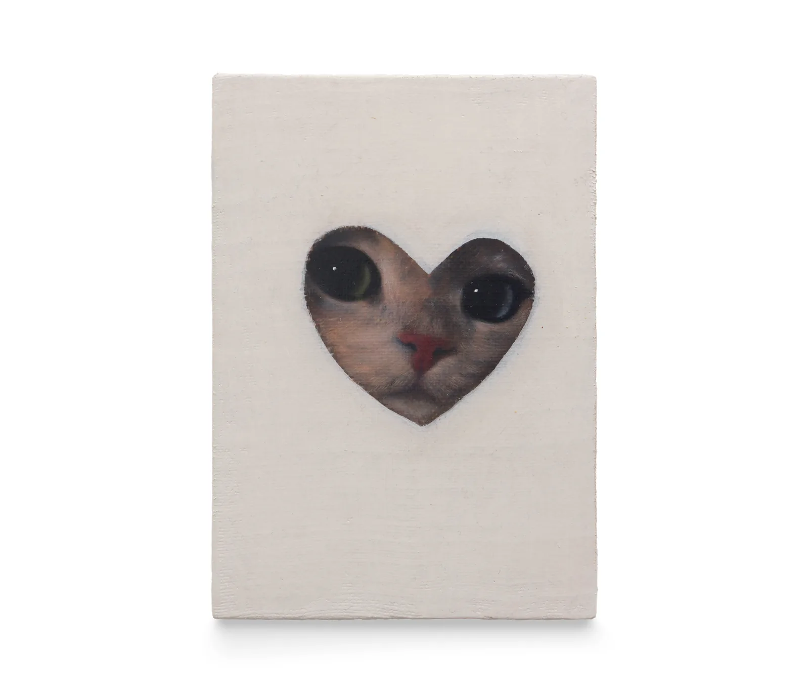 A painting by Joseph Jones of a cat's face framed within a heart