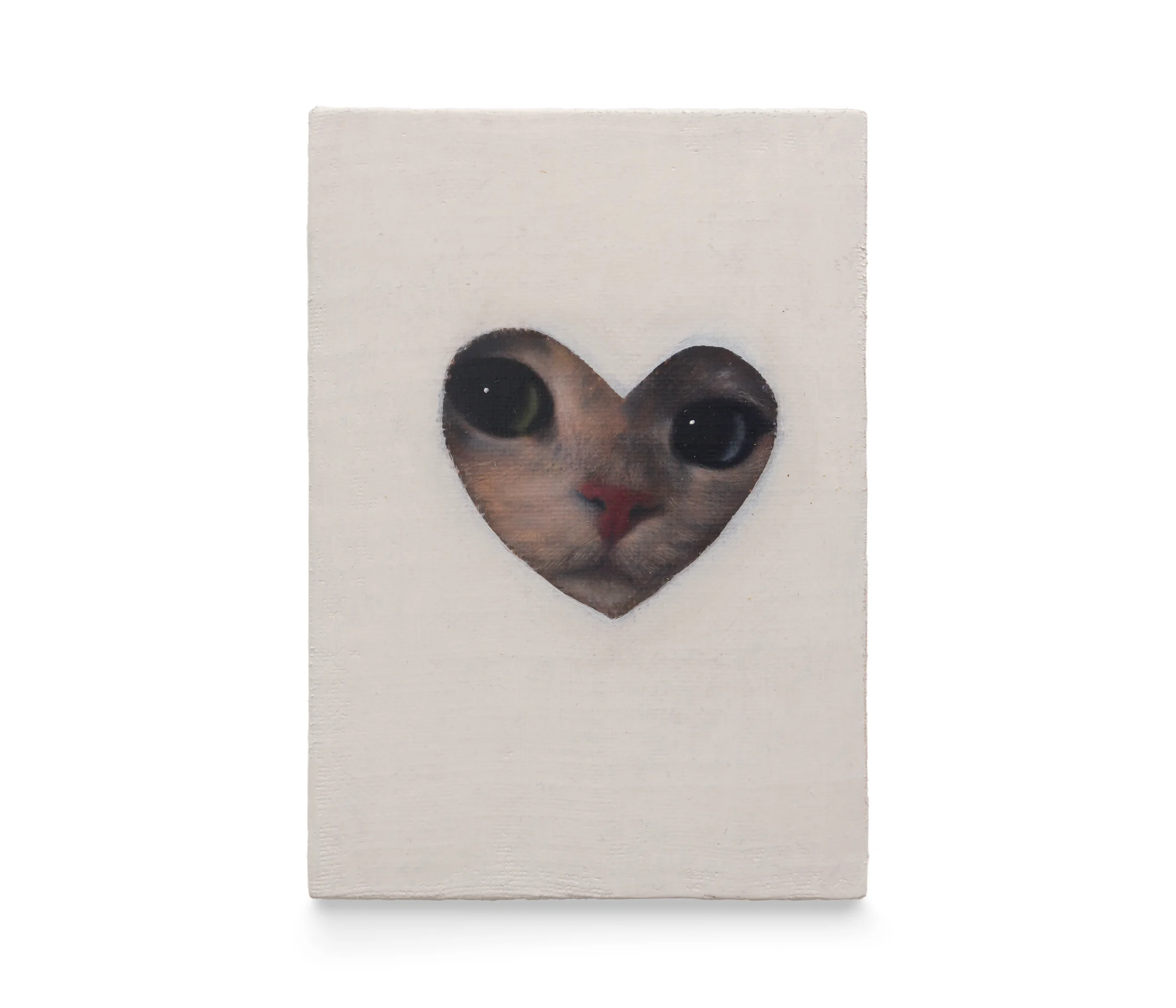 A painting by Joseph Jones of a cat's face framed within a heart