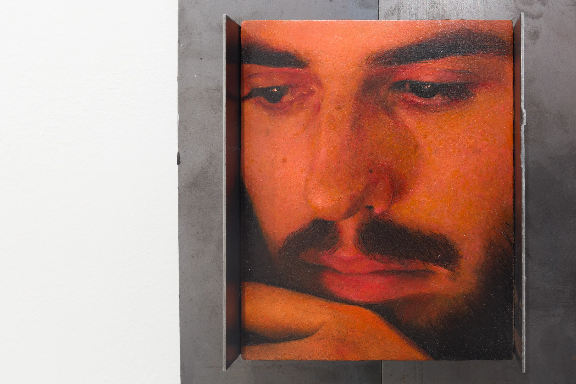 A painting by Ki Yoong of the closeup of a man's face in a metal frame
