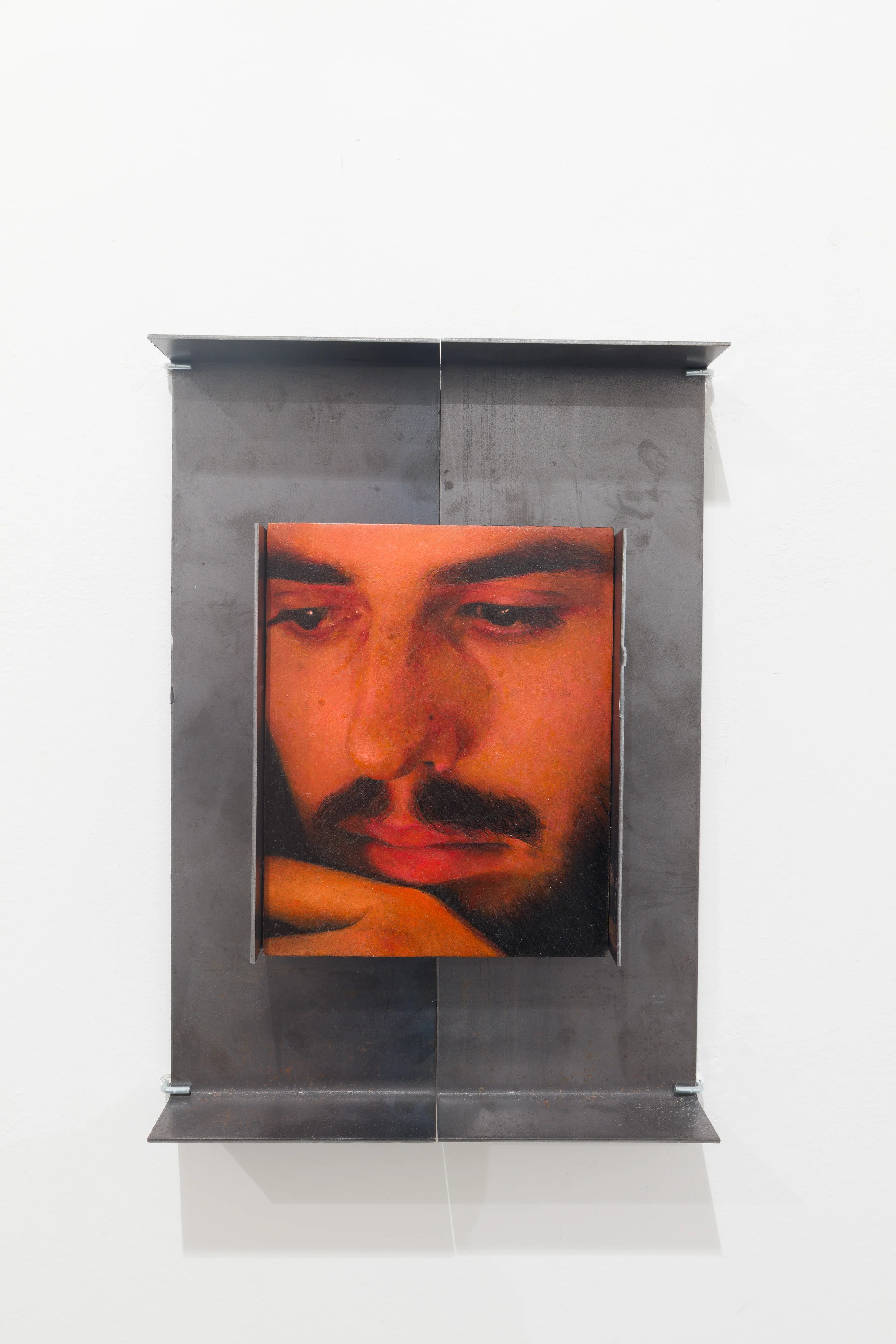 A painting by Ki Yoong of the closeup of a man's face in a metal frame