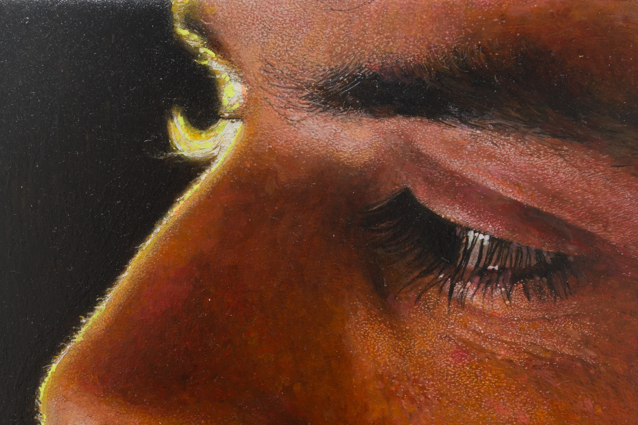 a painting by Ki Yoong of a close up of a male face against a dark background which hangs from a silver necklace