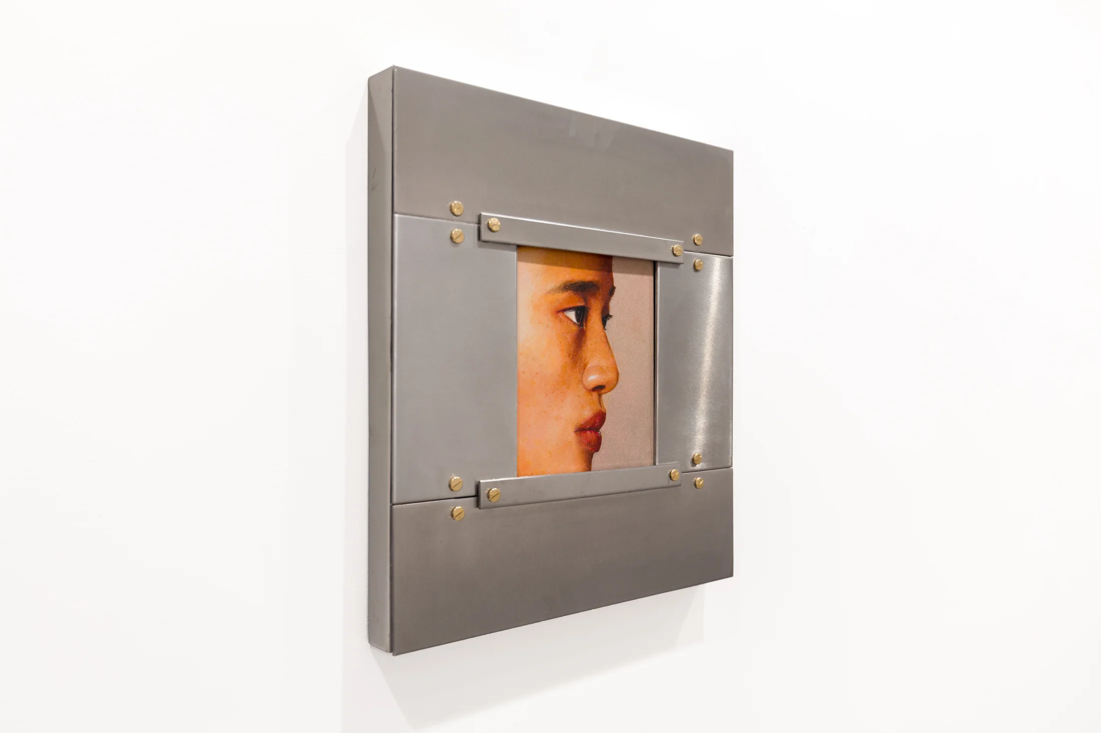 A painting by Ki Yoong of the side profile of a young man's face