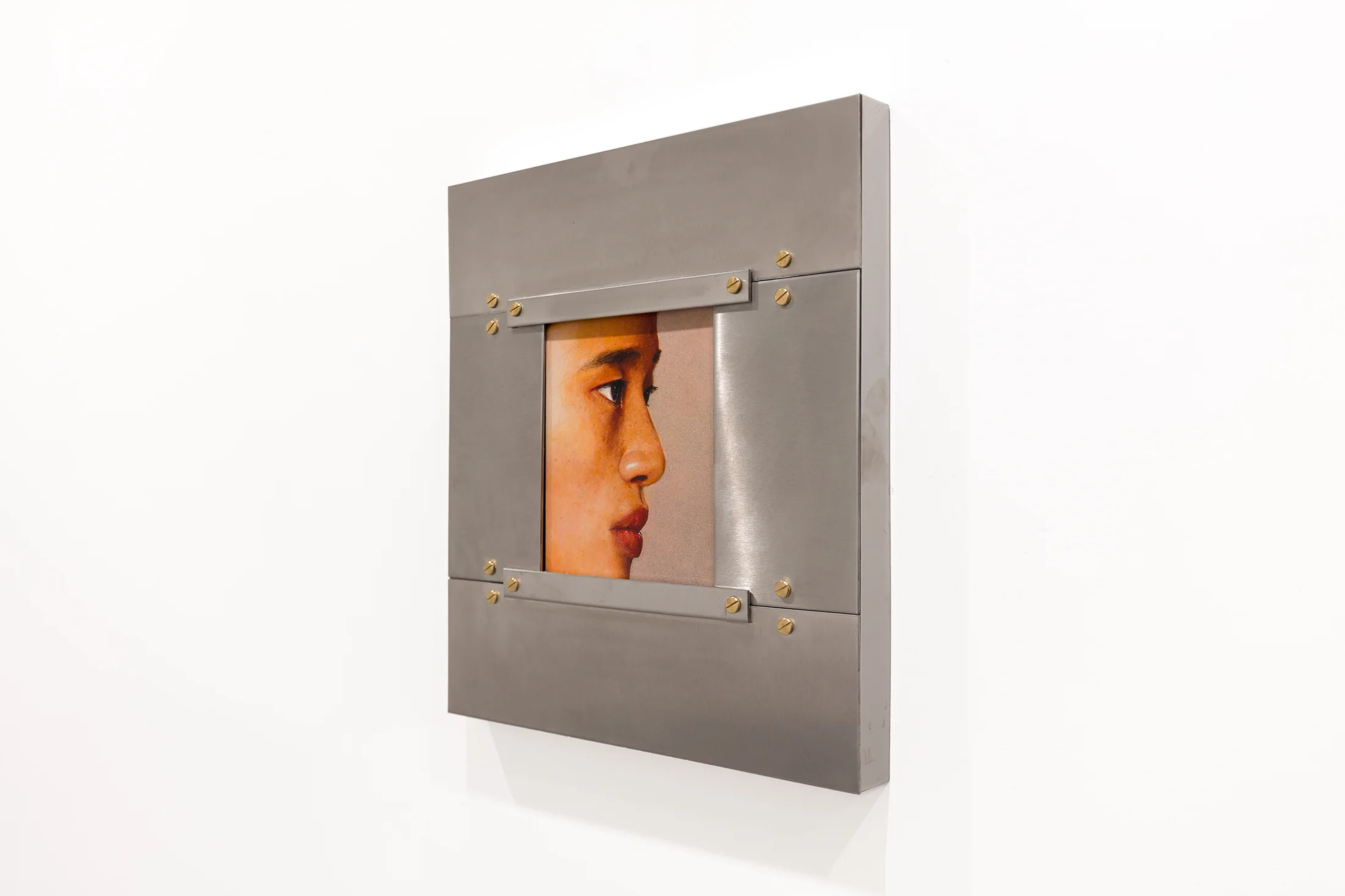 A painting by Ki Yoong of the side profile of a young man's face