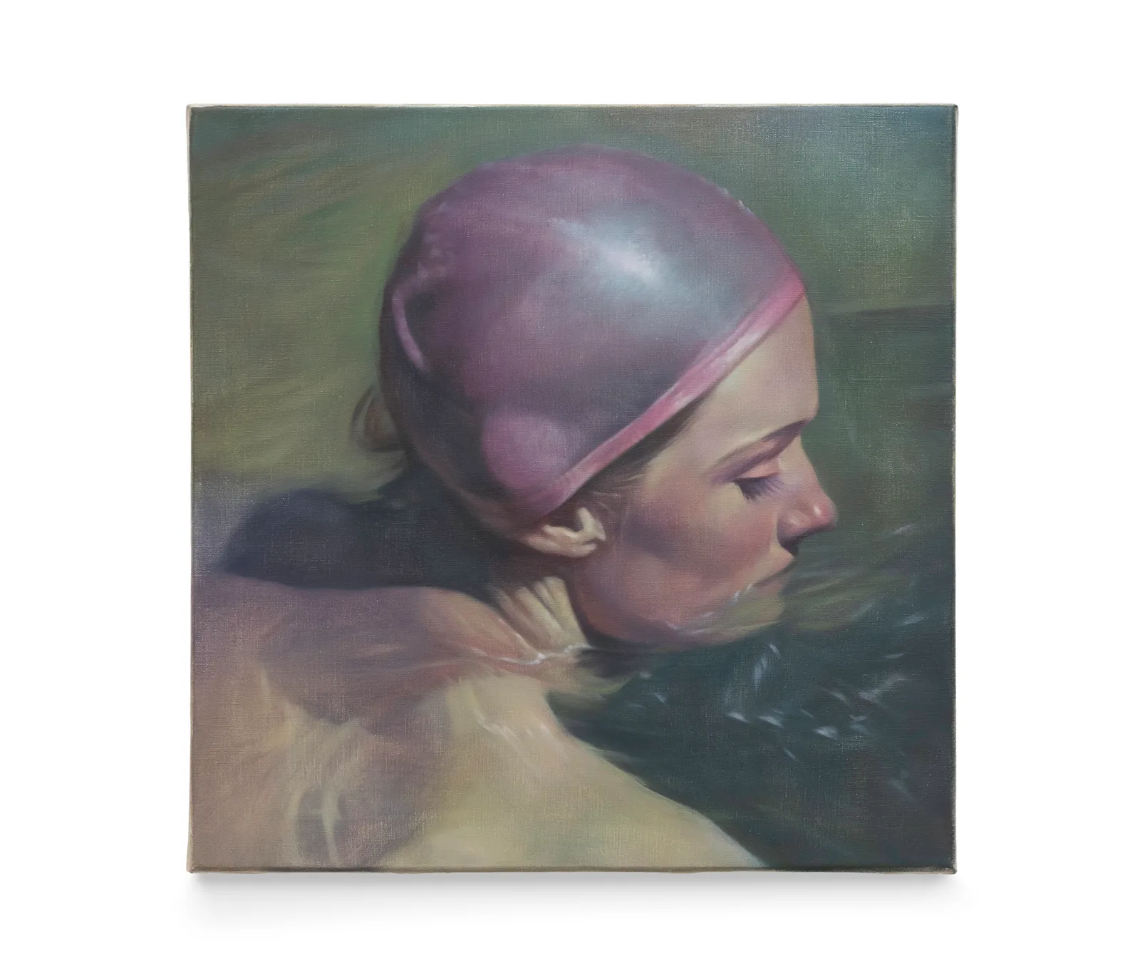 A portrait of a swimmer wearing a pink bathing hat