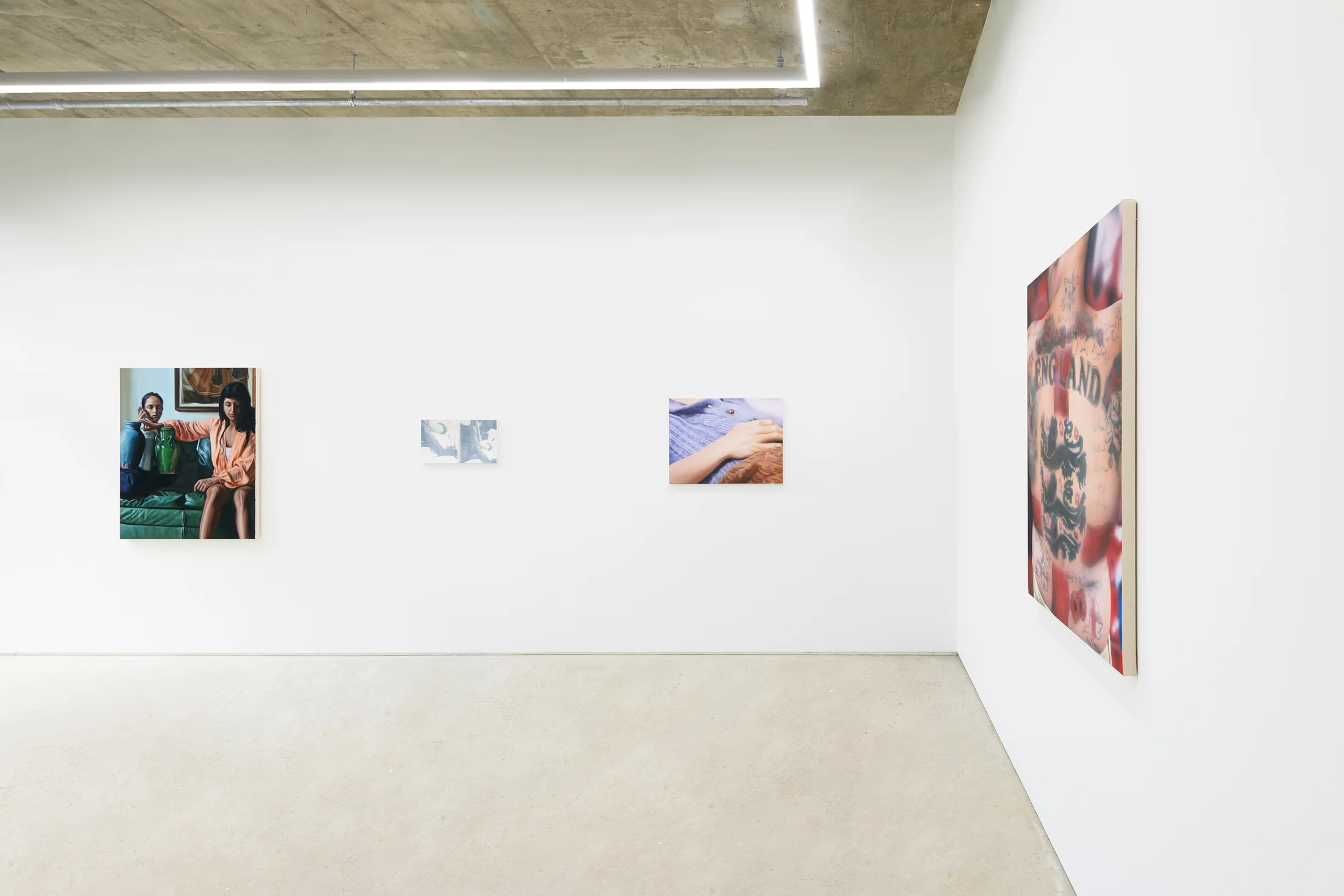 An installation view of a group painting exhibition including a painting by Rachel Lancaster