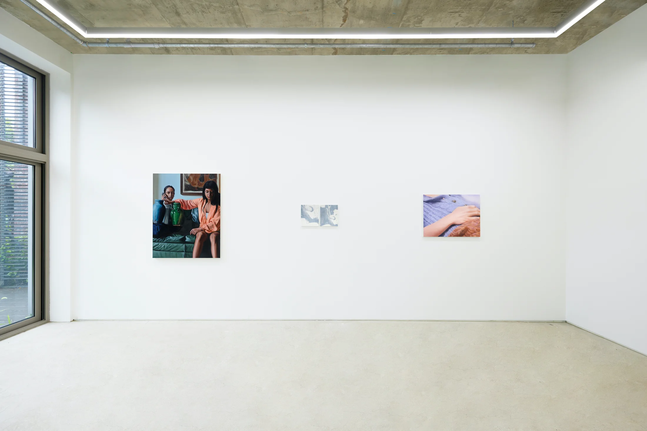 An installation view of a group painting exhibition including a painting by Rachel Lancaster