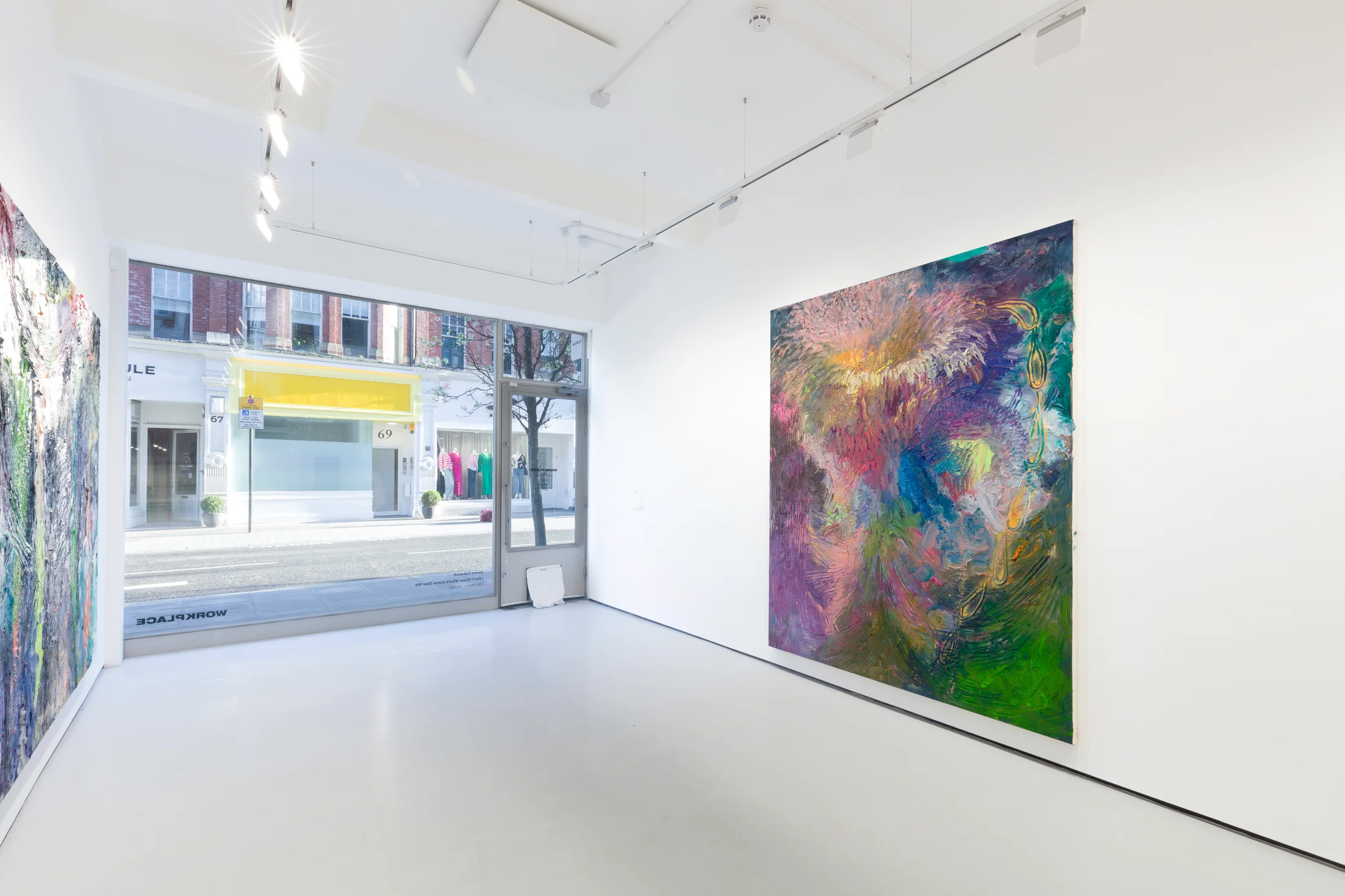 An installation view of James Cabaniuk's solo exhibition with two very large impasto oil paintings on the wall