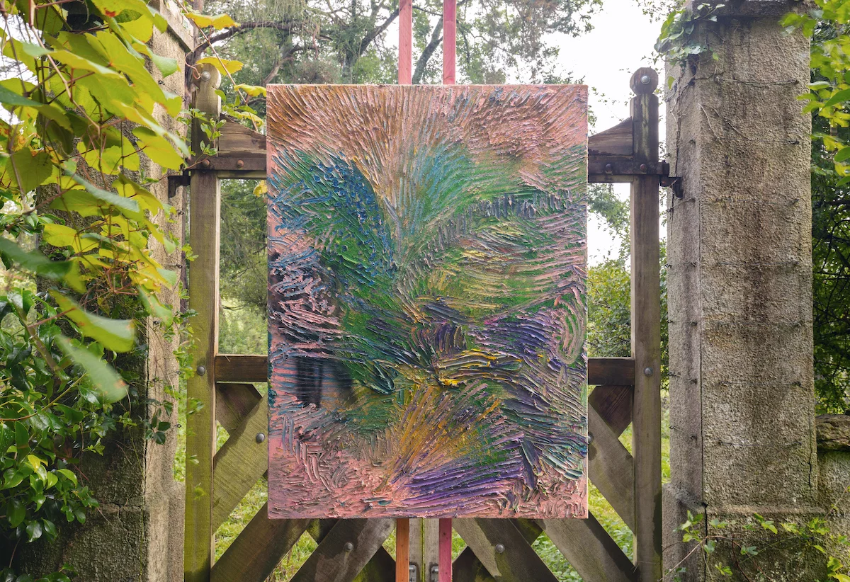 Artworks by James Cabaniuk installed outside in a lush green garden