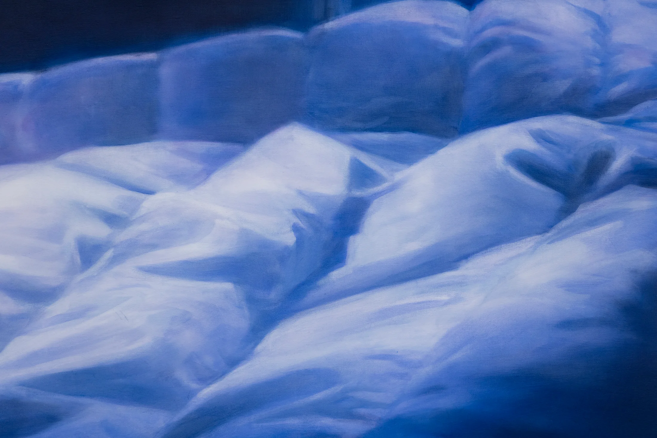 detail crop of Rachel Lancaster's painting 'Lost In Another's Dream' a painting of a duvet shot at night in blue tones