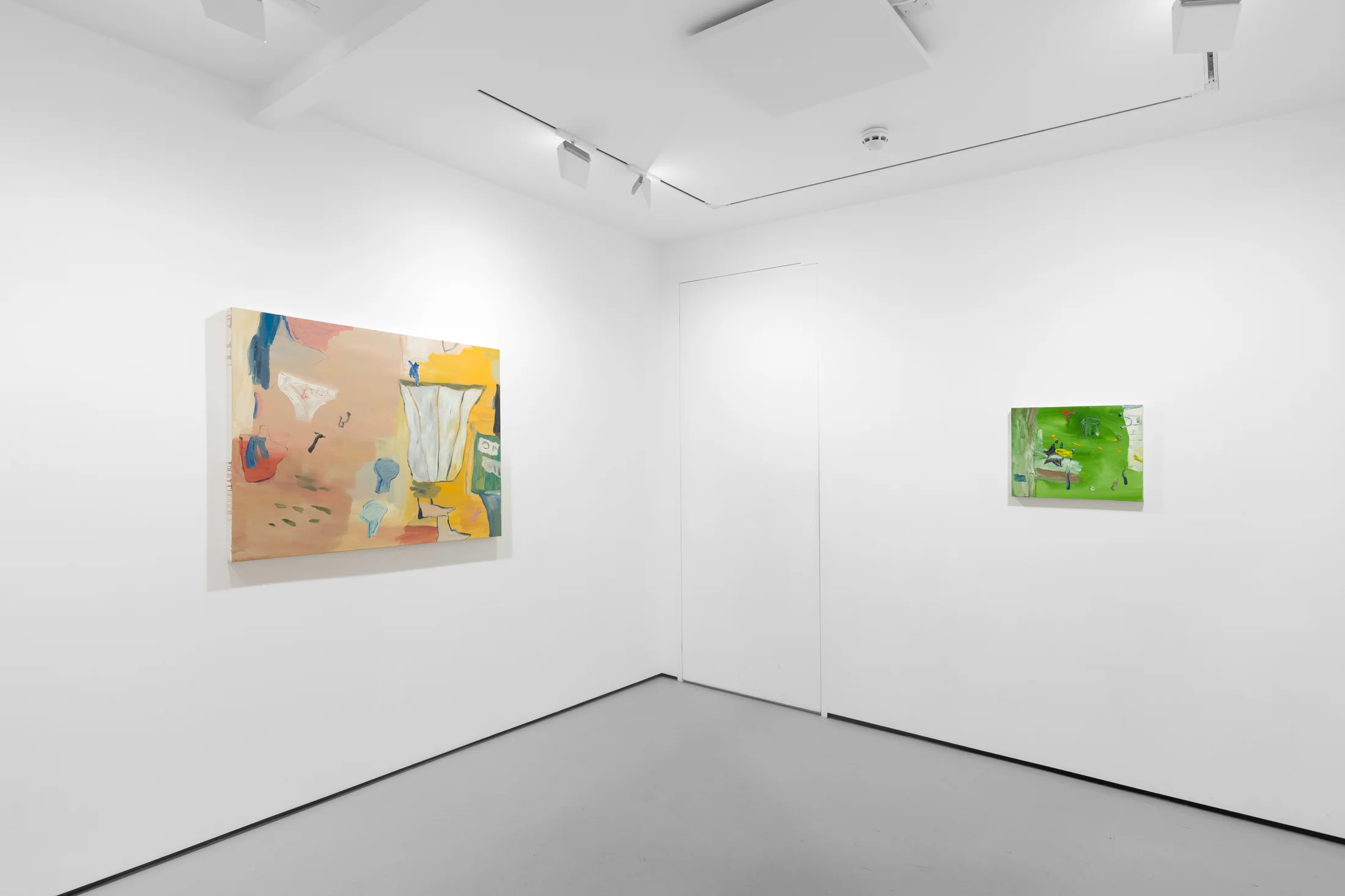 A white walled gallery with 4 artworks by b chehayeb hung on the walls