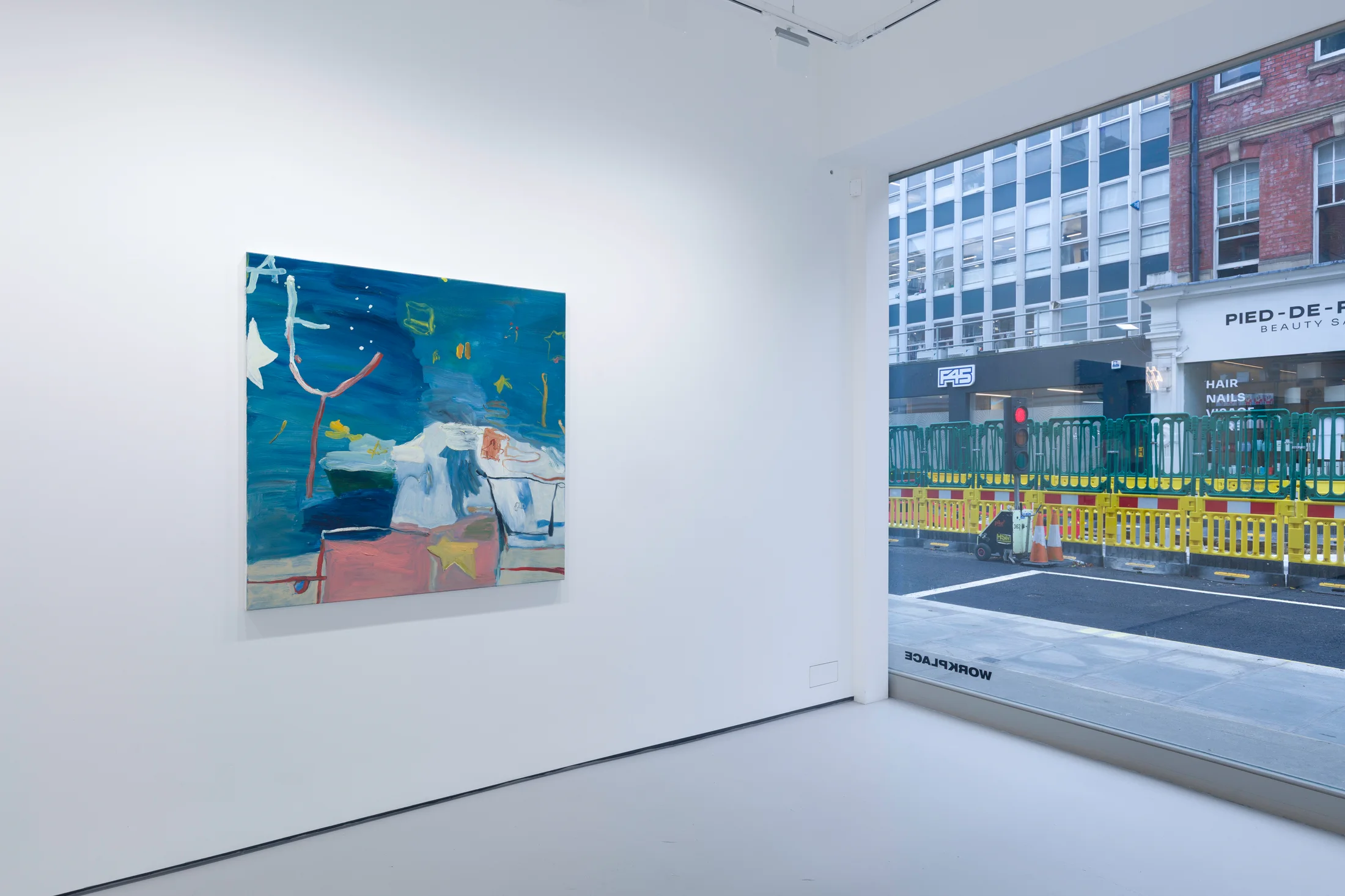 A white walled gallery with 4 artworks by b chehayeb hung on the walls