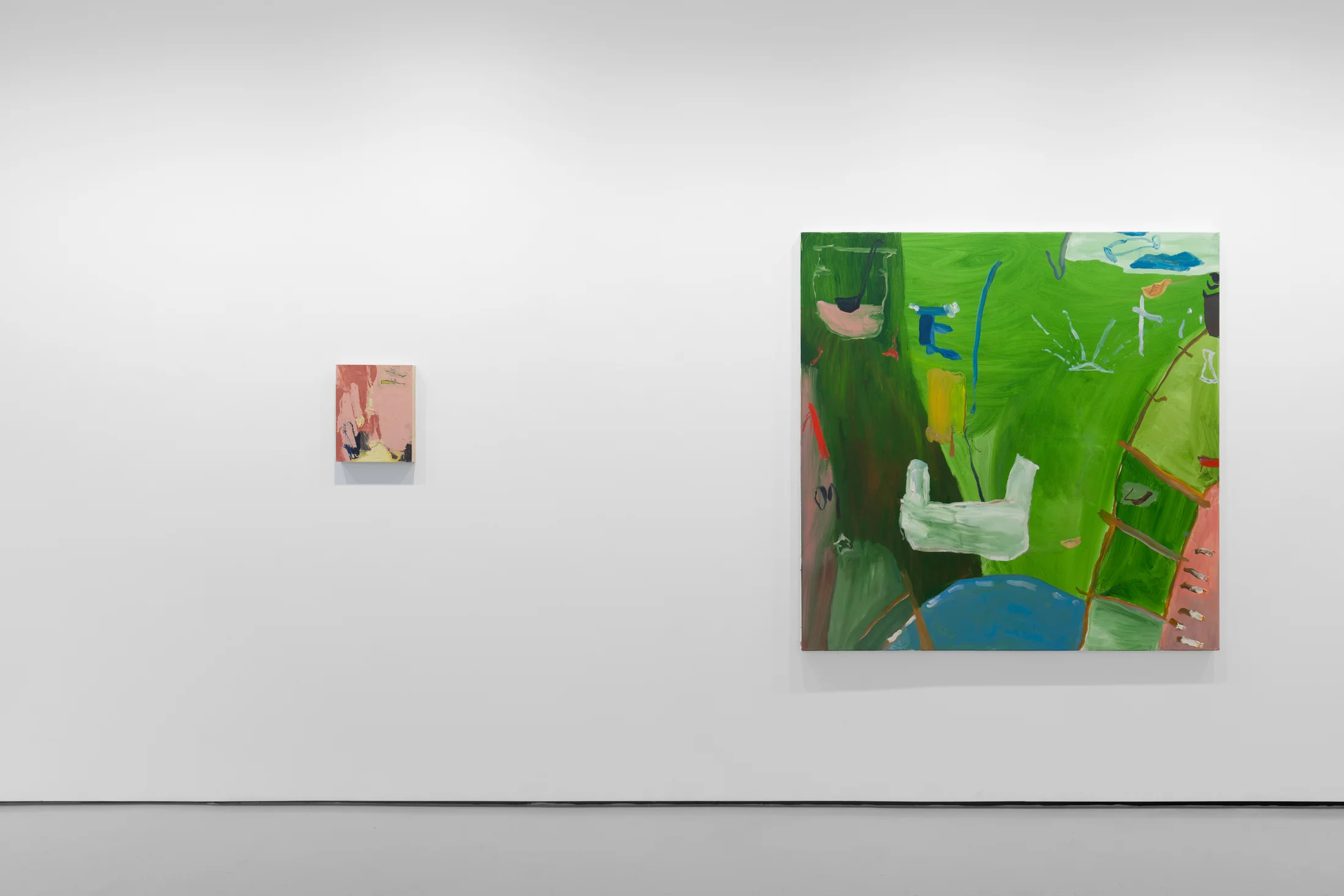 A white walled gallery with 4 artworks by b chehayeb hung on the walls