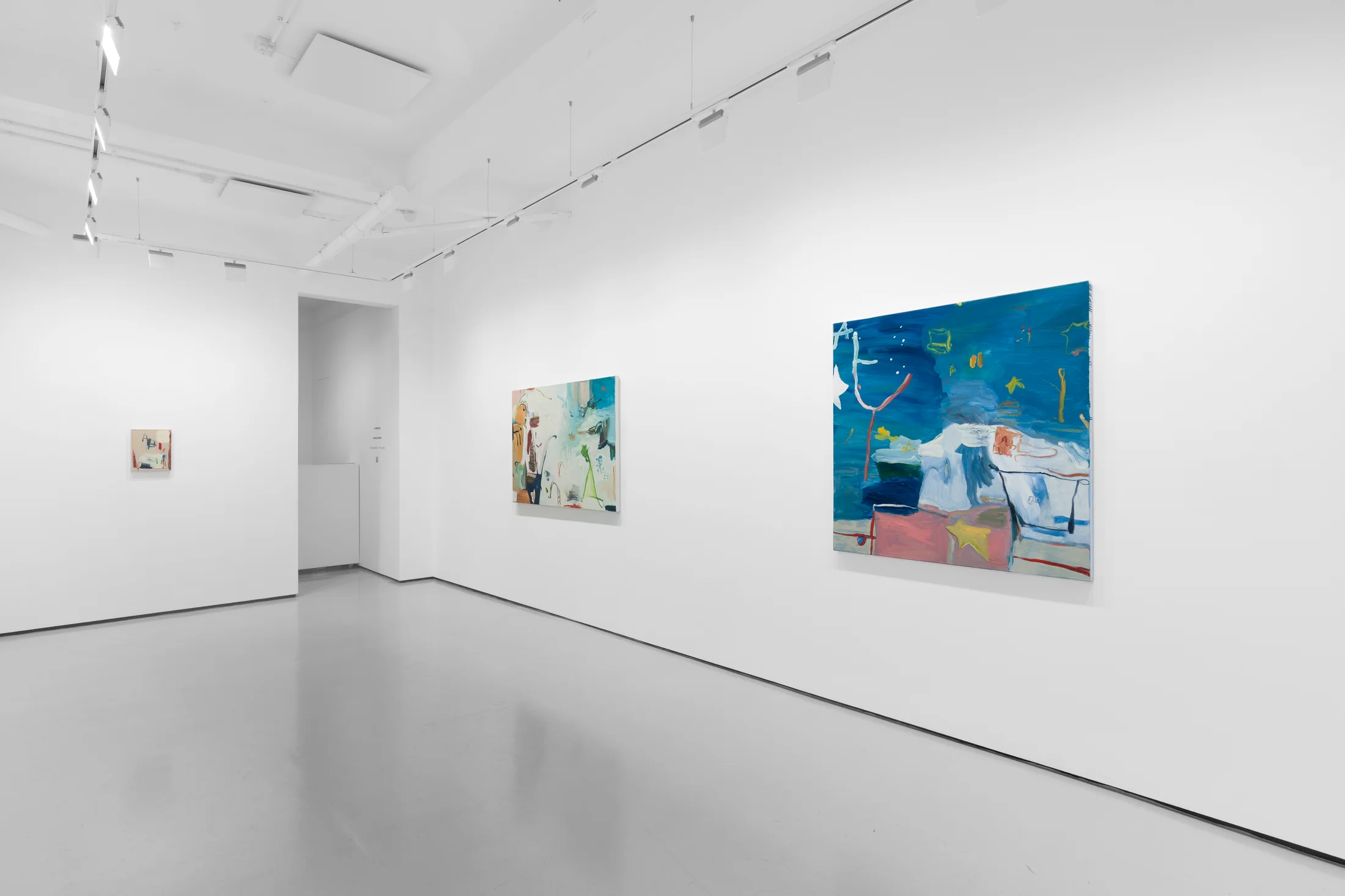 A white walled gallery with 4 artworks by b chehayeb hung on the walls