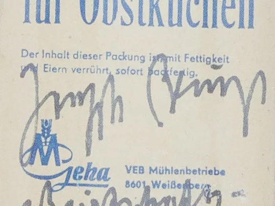 A cropped image of Joseph Beuys' signature on a bag of flour