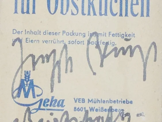 A cropped image of Joseph Beuys' signature on a bag of flour