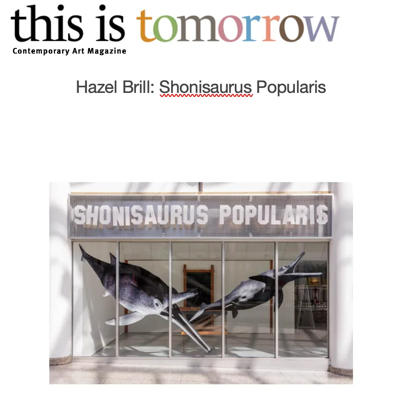 Contemporary Art Magazine Article cover about Hazel Brill with an image of an art installation in a gallery window with suspended whale sculptures